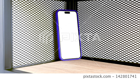 Mockup smartphone with a blank white screen and purple frame leans against a wooden shelf corner. Mockup smartphone with a blank white screen and purple frame leans against a wooden shelf corner. 142801741