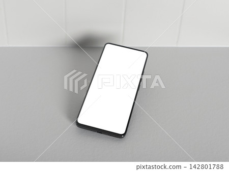 Phone mockup with a blank white screen lies diagonally on a light grey kitchen countertop. Template Phone mockup with a blank white screen lies diagonally on a light grey kitchen countertop. Template 142801788