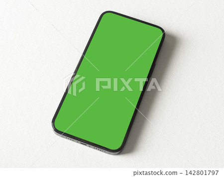 Phone mockup with a green chroma key screen lies horizontally on a plain grey background, Phone mockup with a green chroma key screen lies horizontally on a plain grey background, 142801797