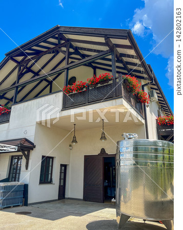 Traditional Serbian Winery Building with Wine Tank Outside Traditional Serbian Winery Building with Wine Tank Outside 142802163