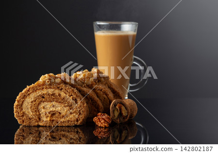 Walnut and buttercream roll: a traditional Oriental pastry. Walnut and buttercream roll: a traditional Oriental pastry. 142802187