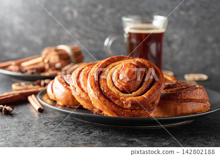 Kanelbullar - Swedish cinnamon buns or rolls. Kanelbullar - Swedish cinnamon buns or rolls. 142802188