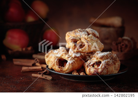 Homemade mini apple strudels with apples and cinnamon. Homemade mini apple strudels with apples and cinnamon. 142802195