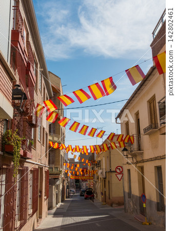 Traditional Southern Spanish Street Decorated with Festive Spanish Bunting Traditional Southern Spanish Street Decorated with Festive Spanish Bunting 142802461