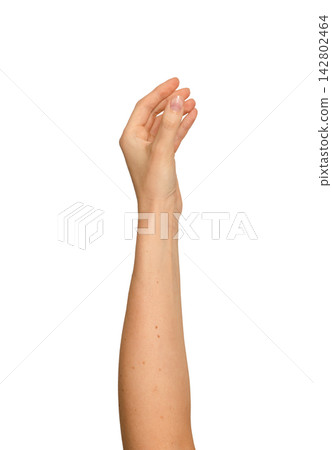 Woman s fingers pinching a tiny invisible item upward. Raised arm demonstrating a delicate grip Woman s fingers pinching a tiny invisible item upward. Raised arm demonstrating a delicate grip 142802464