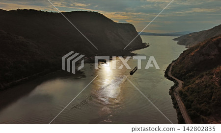 Danube river and mountains in Djerdap National Park at sunset Danube river and mountains in Djerdap National Park at sunset 142802835