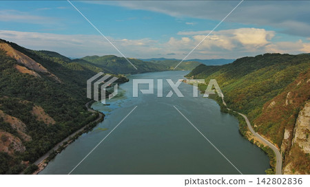 Danube river and mountains in Djerdap National Park at sunset Danube river and mountains in Djerdap National Park at sunset 142802836
