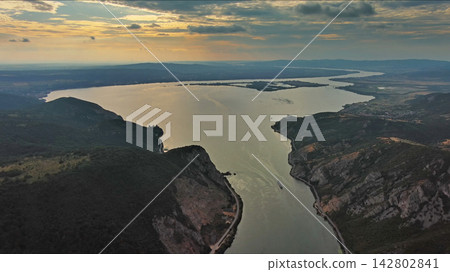 Danube river and mountains in Djerdap National Park at sunset Danube river and mountains in Djerdap National Park at sunset 142802841
