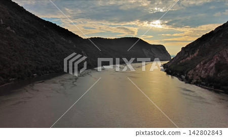 Danube river and mountains in Djerdap National Park at sunset Danube river and mountains in Djerdap National Park at sunset 142802843
