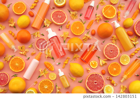 Cosmetic bottles on bright citrus fruits and flowers background, natural scincare cosmetics, beauty and facial care concept image, selective focus, shallow DOF Cosmetic bottles on bright citrus fruits and flowers background, natural scincare cosmetics, beauty and facial care concept image, selective focus, shallow DOF 142803151