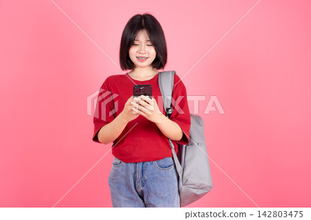 Asian Student Woman Using Mobile Phone Messaging Concept Isolated Pink Background Asian Student Woman Using Mobile Phone Messaging Concept Isolated Pink Background 142803475