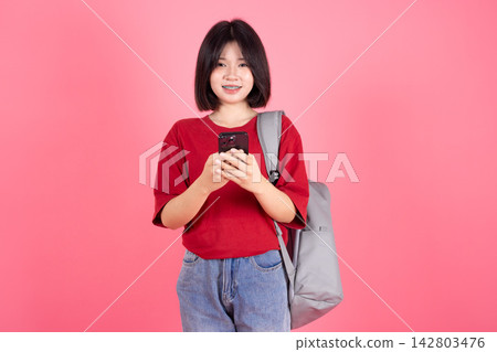 Asian Student Woman Using Mobile Phone Messaging Concept Isolated Pink Background Asian Student Woman Using Mobile Phone Messaging Concept Isolated Pink Background 142803476