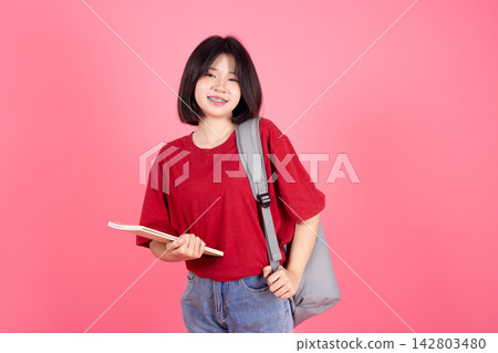 Young Asian Woman Student Carrying Backpack Book College Campus Studio Background Young Asian Woman Student Carrying Backpack Book College Campus Studio Background 142803480
