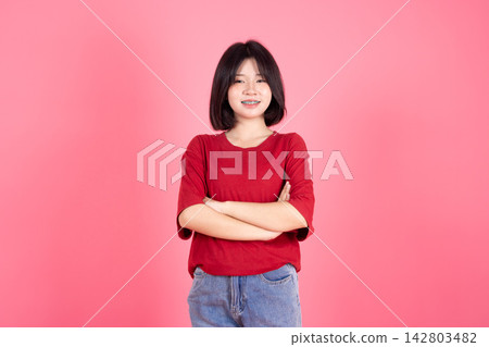 Asian Thai Student casual cute teen girl lovely portrait studio shot isolate on pink background. 142803482