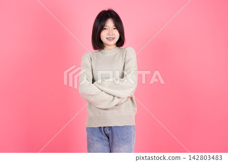 Asian Thai Student casual cute teen girl lovely portrait studio shot isolate on pink background. Asian Thai Student casual cute teen girl lovely portrait studio shot isolate on pink background. 142803483