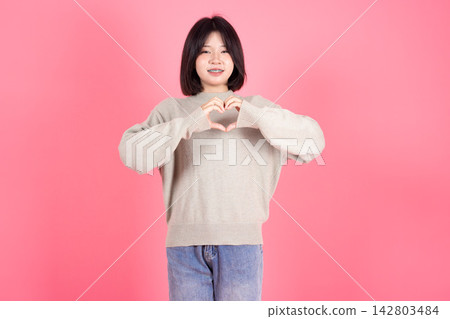 Asian Thai Student casual cute teen girl lovely portrait studio shot isolate on pink background. Asian Thai Student casual cute teen girl lovely portrait studio shot isolate on pink background. 142803484