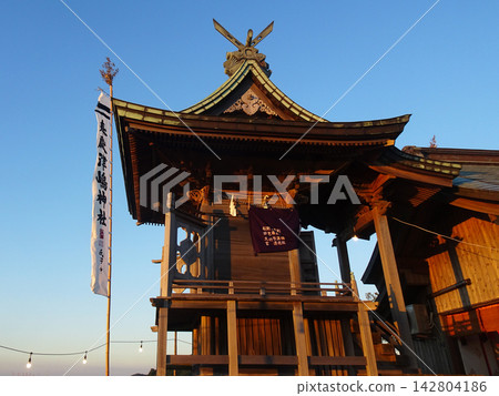 The shrine buildings and votive banners of Tsushima Shrine illuminated by the setting sun (Mitoyo City, Kagawa Prefecture - Summer Grand Festival) The shrine buildings and votive banners of Tsushima Shrine illuminated by the setting sun (Mitoyo City, Kagawa Prefecture - Summer Grand Festival) 142804186