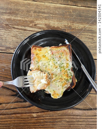 Freshly baked, thick-cut cheese toast with gooey, stretchy cheese. Freshly baked, thick-cut cheese toast with gooey, stretchy cheese. 142804341
