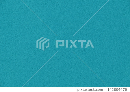 A vibrant turquoise blue felt fabric close-up background material, perfect texture for summer designs and crafts. A vibrant turquoise blue felt fabric close-up background material, perfect texture for summer designs and crafts. 142804476