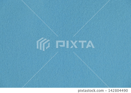A refreshing blue felt fabric close-up background material, perfect texture for summer crafts and smart designs. A refreshing blue felt fabric close-up background material, perfect texture for summer crafts and smart designs. 142804490