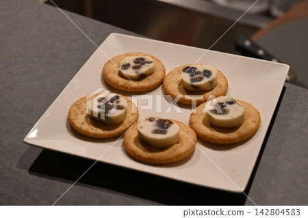 A simple appetizer plate topped with raisin butter. A simple appetizer plate topped with raisin butter. 142804583