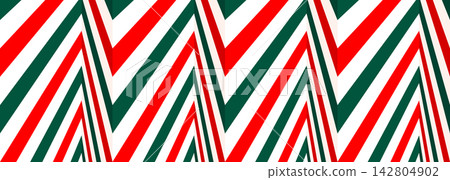 Christmas candy cane stripes abstract background with red and green chevron zigzag pattern Christmas candy cane stripes abstract background with red and green chevron zigzag pattern 142804902