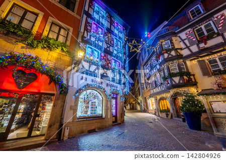 Colmar, France, is a magical cityscape beautifully lit up with blue illuminations and Christmas decorations. Colmar, France, is a magical cityscape beautifully lit up with blue illuminations and Christmas decorations. 142804926