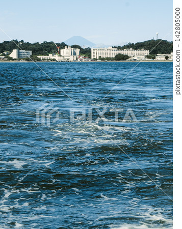 A view of the sparkling blue ocean and Mount Fuji in the distance off the coast of Sarushima Island in Yokosuka. A view of the sparkling blue ocean and Mount Fuji in the distance off the coast of Sarushima Island in Yokosuka. 142805000