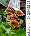 Fresh Figs with Honey and Basil Leaves, Sliced Fig Rustic Food Still Life	 142805201