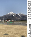 Snow-covered Mount Bandai and the rural landscape of Inawashiro Town 142805422