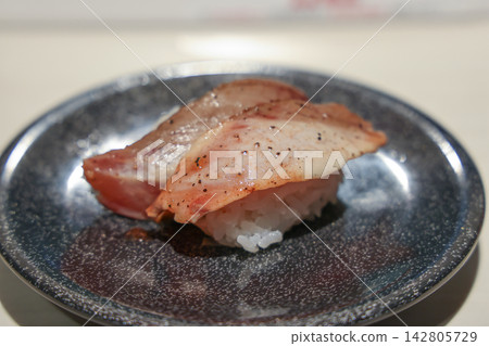 Japan April 29 2026 Seared fish nigiri sushi on plate Japan April 29 2026 Seared fish nigiri sushi on plate 142805729