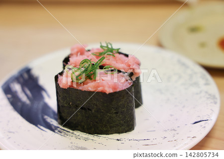 Japan April 29 2026 Tuna gunkan sushi topped with garnish Japan April 29 2026 Tuna gunkan sushi topped with garnish 142805734