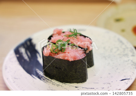 Japan April 29 2026 Tuna gunkan sushi topped with garnish Japan April 29 2026 Tuna gunkan sushi topped with garnish 142805735