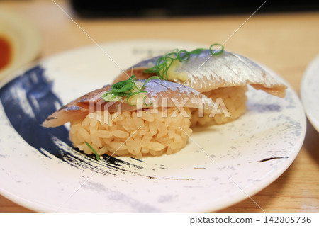 Japan April 29 2026 Silver fish nigiri sushi with garnish 142805736