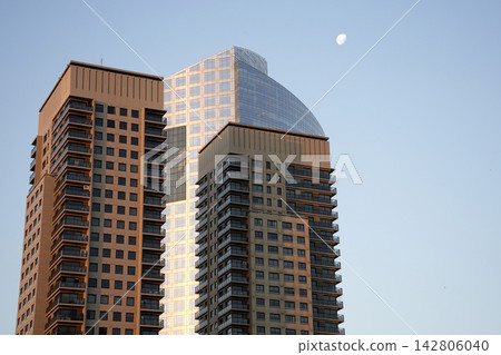 Modern Skyscrapers at Golden Hour with Moon in Buenos Aires Modern Skyscrapers at Golden Hour with Moon in Buenos Aires 142806040
