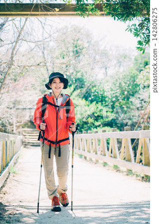 A woman trekking A woman trekking 142806275