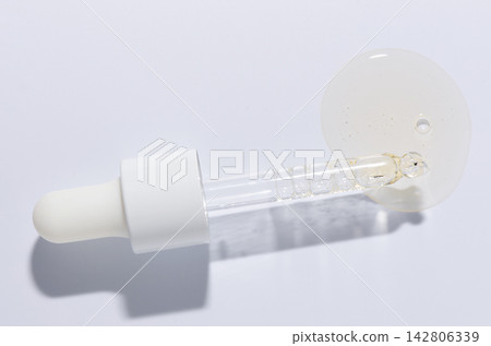 Liquid cosmetic product for the skin or medicine in a pipette. Copy space Liquid cosmetic product for the skin or medicine in a pipette. Copy space 142806339