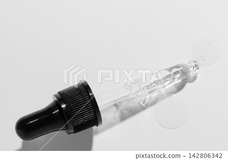 Liquid cosmetic product for the skin or medicine in a pipette. Copy space Liquid cosmetic product for the skin or medicine in a pipette. Copy space 142806342