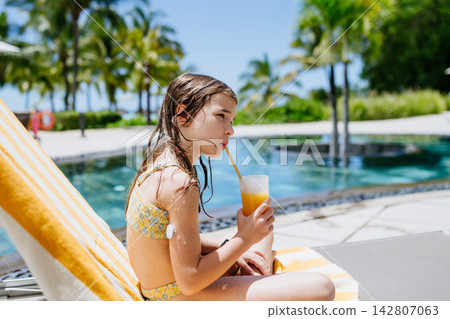 Diabetic girl during tropical beach vacation. Diabetic girl during tropical beach vacation. 142807063