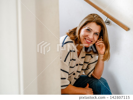 Beautiful woman resting, sitting on stairs. Beautiful woman resting, sitting on stairs. 142807115