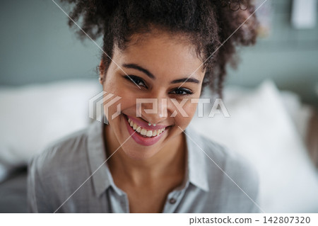 Portrait of beautiful young woman with curly hair. Portrait of beautiful young woman with curly hair. 142807320