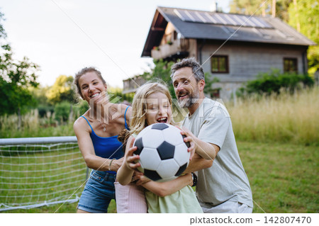 Loving mother and father sharing playful moment with son. Loving mother and father sharing playful moment with son. 142807470