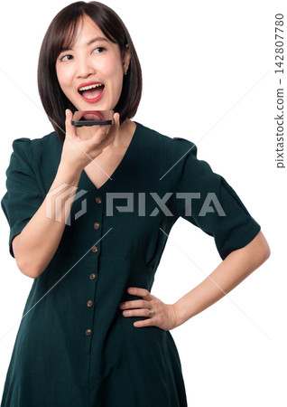 Happy excited asian woman speaks to smartphone artificial intelligence chatbot using voice command technology isolated against plain background for modern digital lifestyle concept Happy excited asian woman speaks to smartphone artificial intelligence chatbot using voice command technology isolated against plain background for modern digital lifestyle concept 142807780