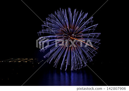 A night view of Shirahama Beach in Wakayama Prefecture. Fireworks are reflected on the sea surface. A night view of Shirahama Beach in Wakayama Prefecture. Fireworks are reflected on the sea surface. 142807906