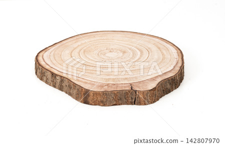 Natural round wood slice with visible tree rings and bark isolated on white background Natural round wood slice with visible tree rings and bark isolated on white background 142807970