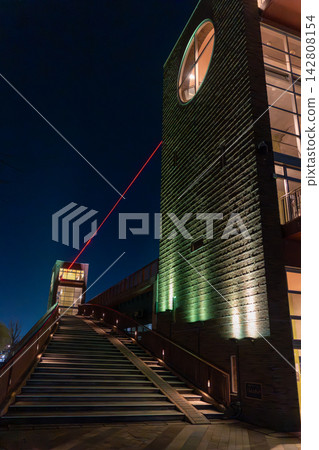 The Tenmon Bridge observation tower and the red thread light-up shine brightly in Fugan Canal Kansui Park at night. The Tenmon Bridge observation tower and the red thread light-up shine brightly in Fugan Canal Kansui Park at night. 142808154