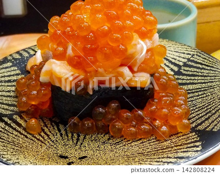 A huge pile of salmon roe gunkan maki A huge pile of salmon roe gunkan maki 142808224