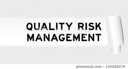 Ripped gray paper background that have word quality risk management under torn part 142808374