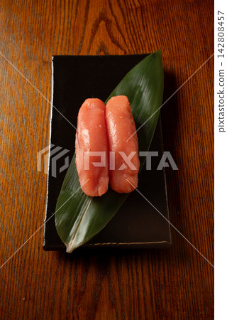 High-quality cod roe served on a black plate High-quality cod roe served on a black plate 142808457
