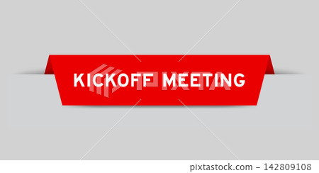 Red color inserted label with word kickoff meeting on gray background Red color inserted label with word kickoff meeting on gray background 142809108